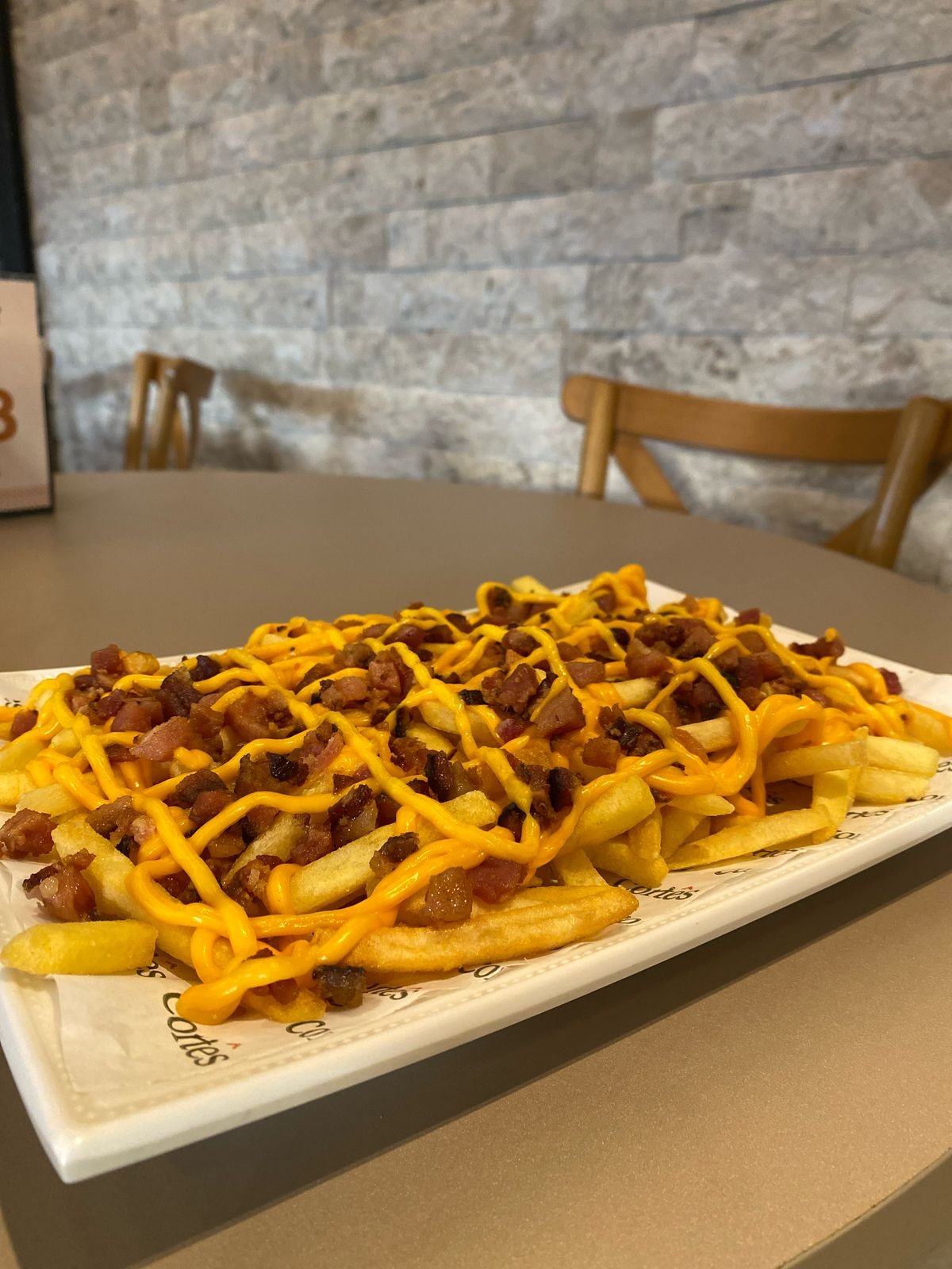 PORCAO BATATA FRITA (250 GRAMAS) ACOMPANHADO COM CHEDDER CREMOSO E BACON